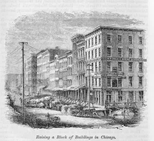 Raising a block of buildings in Chicago, from Our Whole Country: The Past Raising a block of buildings in Chicago, from Our Whole Country: The Past