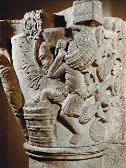 Romanesque art: capital of a limestone column decorated with a low relief representing a Romanesque art: capital of a limestone column decorated with a low relief representing a
