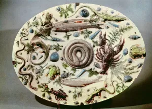 Rustique Figuline dish with a white background (faience) Rustique Figuline dish with a white background (faience)