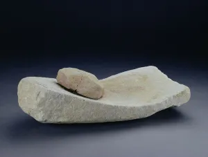 Saddle quern with grinding stone, from a farm at Mingies Ditch, Oxfordshire Saddle quern with grinding stone, from a farm at Mingies Ditch, Oxfordshire