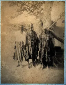 Three Senegalese Men in Traditional Costume (b/w photo) Three Senegalese Men in Traditional Costume (b/w photo)