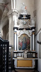 Southern side chapel west side, Sint-Michiels, leaves baroque altarpiece of marbled wood with statues at the top by E Southern side chapel west side, Sint-Michiels, leaves baroque altarpiece of marbled wood with statues at the top by E