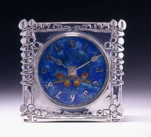 A square clock with a celtic motif in the Arts & Crafts style, 1905 (silver and enamel) A square clock with a celtic motif in the Arts & Crafts style, 1905 (silver and enamel)