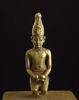 Statuette of king in the white crown offering two wine bowls (solid cast electrum) Statuette of king in the white crown offering two wine bowls (solid cast electrum)
