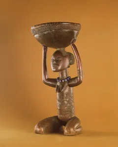Stoolwith a kneeling female caryatid, Democratic Republic of the Congo (wood & glass beads) Stoolwith a kneeling female caryatid, Democratic Republic of the Congo (wood & glass beads)