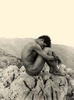 Landscapes (modern interpretation) Collection: Study of a male nude on a rock, Taormina, Sicily, c. 1900 (sepia photo)