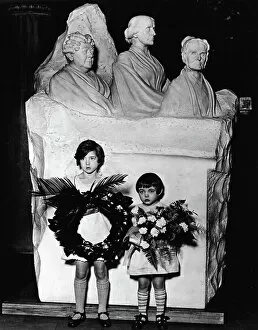 Nostalgic Gallery: Suffrage descendants Peggy and Hope Anthony hold floral tributes in front of the Woman Suffrage