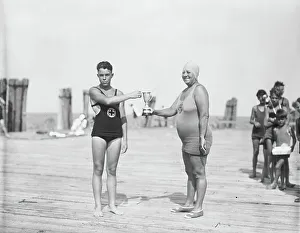 Tournament Gallery: Two Swimmers Holding Trophy, 1927 (b/w photo)