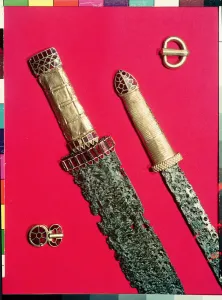 Two swords with decorated hilts and two belt buckles, from the Pouan Treasure (gold Two swords with decorated hilts and two belt buckles, from the Pouan Treasure (gold