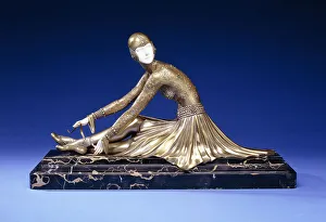 Tamara, a Figure of a Ballerina Tying her Shoe, early 20th century (gilt-bronze, silvered, ivory) Tamara, a Figure of a Ballerina Tying her Shoe, early 20th century (gilt-bronze, silvered, ivory)