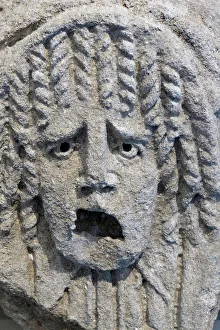 A tragic theatre mask, 1st or 2nd century (low relief) A tragic theatre mask, 1st or 2nd century (low relief)
