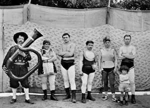 The troupe of the traveling circus in Andelot Blancheville (Haute Marne), poses in stage costume wrestlers, acrobats The troupe of the traveling circus in Andelot Blancheville (Haute Marne), poses in stage costume wrestlers, acrobats