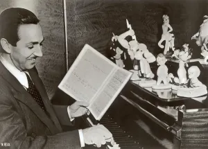 Walt Disney plays piano to a group of figures of Disney characters, c.1940 (b/w photo) Walt Disney plays piano to a group of figures of Disney characters, c.1940 (b/w photo)
