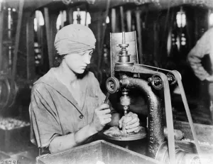 Woman countersinking detonator tube hole and filling hole in hand grenade at Westinghouse Woman countersinking detonator tube hole and filling hole in hand grenade at Westinghouse