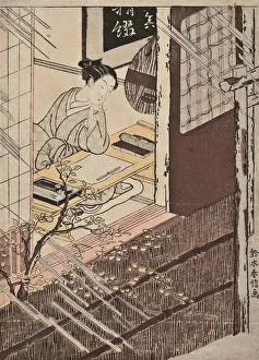 A woman seated at a writing desk looking out at the rain A woman seated at a writing desk looking out at the rain