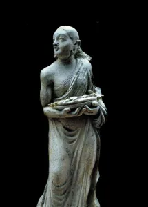 Woman wearing flowers. Sculpture of the 2nd century. From Afghanistan Woman wearing flowers. Sculpture of the 2nd century. From Afghanistan