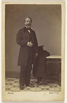 bearded man standing top hat coat table Mathew B bearded man standing top hat coat table Mathew B