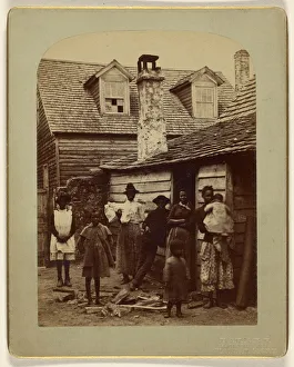 Black family grouping eight posed house entrance Black family grouping eight posed house entrance