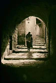 Nicodemus came Jesus night Man walking arched street Nicodemus came Jesus night Man walking arched street