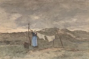 Woman clothesline dunes sea visible hanging wash Woman clothesline dunes sea visible hanging wash