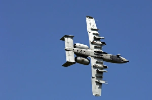 An A-10 Thunderbolt maneuvers through the sky An A-10 Thunderbolt maneuvers through the sky