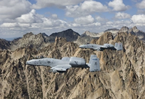 Two A-10 Thunderbolts fly over the mountains in Central Idaho Two A-10 Thunderbolts fly over the mountains in Central Idaho