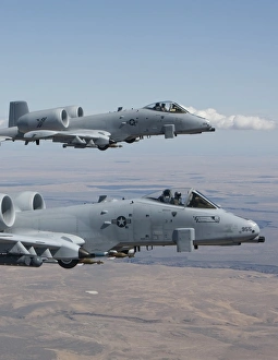 Two A-10 Thunderbolts fly over the Saylor Creek bombing range, Idaho Two A-10 Thunderbolts fly over the Saylor Creek bombing range, Idaho