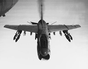 An A-7 Corsair II flies toward targets in Vietnam, armed with bomb clusters, 1969 An A-7 Corsair II flies toward targets in Vietnam, armed with bomb clusters, 1969