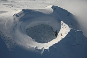 Aerial view of frozen lake in summit crater Mount Douglas volcano, Alaskan Peninsula Aerial view of frozen lake in summit crater Mount Douglas volcano, Alaskan Peninsula