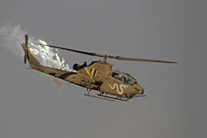An AH-1S Tzefa of the Israeli Air Force dispenses flares An AH-1S Tzefa of the Israeli Air Force dispenses flares