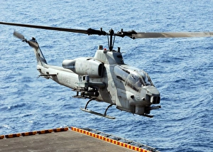 An AH-1W Super Cobra helicopter launches off the flight deck of USS Peleliu An AH-1W Super Cobra helicopter launches off the flight deck of USS Peleliu
