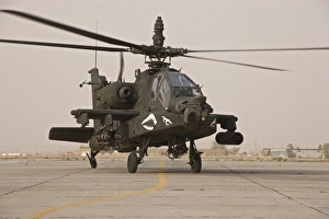 An AH-64 Apache helicopter taxiing on the flight line An AH-64 Apache helicopter taxiing on the flight line