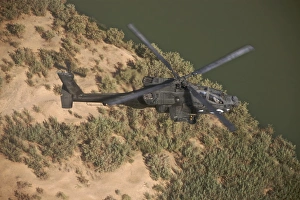 An AH-64D Apache helicopter in flight over Northern Iraq An AH-64D Apache helicopter in flight over Northern Iraq