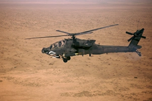 An AH-64D Apache Longbow fires a hydra rocket over northern Iraq An AH-64D Apache Longbow fires a hydra rocket over northern Iraq