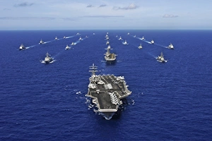 Aircraft carrier USS Ronald Reagan transits the Pacific Ocean with a fleet of ships Aircraft carrier USS Ronald Reagan transits the Pacific Ocean with a fleet of ships