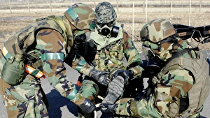 Airmen assist a Republic of Korea Army soldier with decontamination of his gears Airmen assist a Republic of Korea Army soldier with decontamination of his gears