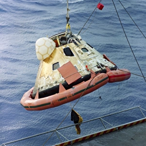 The Apollo 8 capsule being hoisted aboard the recovery carrier The Apollo 8 capsule being hoisted aboard the recovery carrier