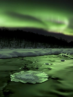 Aurora Borealis reflects off the Tennevik River, Troms County, Norway Aurora Borealis reflects off the Tennevik River, Troms County, Norway