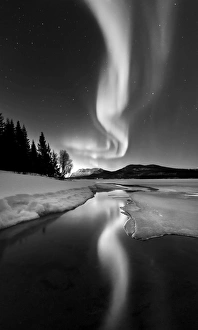 Aurora Borealis over Sandvannet Lake in Troms County, Norway Aurora Borealis over Sandvannet Lake in Troms County, Norway