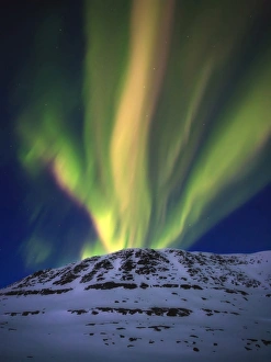 Aurora Borealis over Toviktinden Mountain in Troms County, Norway Aurora Borealis over Toviktinden Mountain in Troms County, Norway