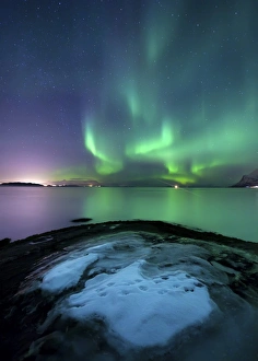 Aurora Borealis over Vagsfjorden outside of Harstad in Northern Norway Aurora Borealis over Vagsfjorden outside of Harstad in Northern Norway