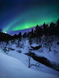 Aurora and a Full Moon over Tennevik River, Troms County, Norway Aurora and a Full Moon over Tennevik River, Troms County, Norway