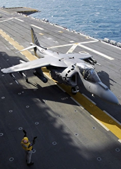 An AV-8B Harrier taxis forward after landing onboard USS Nassau An AV-8B Harrier taxis forward after landing onboard USS Nassau