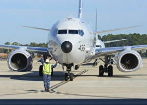 Aviation Electronics Technician prepares to launch a P-8A Poseidon Aviation Electronics Technician prepares to launch a P-8A Poseidon