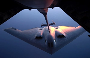 A B-2 Spirit bomber conducts a refueling with a KC-10 Extender A B-2 Spirit bomber conducts a refueling with a KC-10 Extender