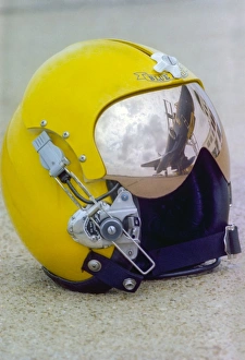 A Blue Angels pilot helmet with aircraft reflection in visor A Blue Angels pilot helmet with aircraft reflection in visor