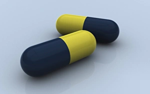 <b class=qtipBold><figcaption>Blue and yellow medication capsules</figcaption></b><br>Blue and yellow medication capsules on colored background.<br><em>© Stocktrek Images</em> Blue and yellow medication capsules