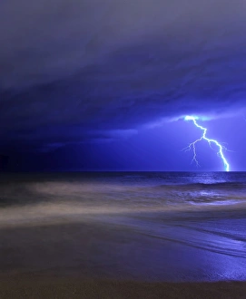A bolt of lightning from an approaching storm in Miramar, Argentina A bolt of lightning from an approaching storm in Miramar, Argentina