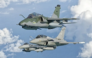 A Brazilian Air Force Embraer A-1B, French Air Force Rafale, and a U A Brazilian Air Force Embraer A-1B, French Air Force Rafale, and a U