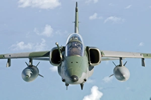 A Brazilian Air Force Embraer A-1B soars through the sky over Brazil A Brazilian Air Force Embraer A-1B soars through the sky over Brazil